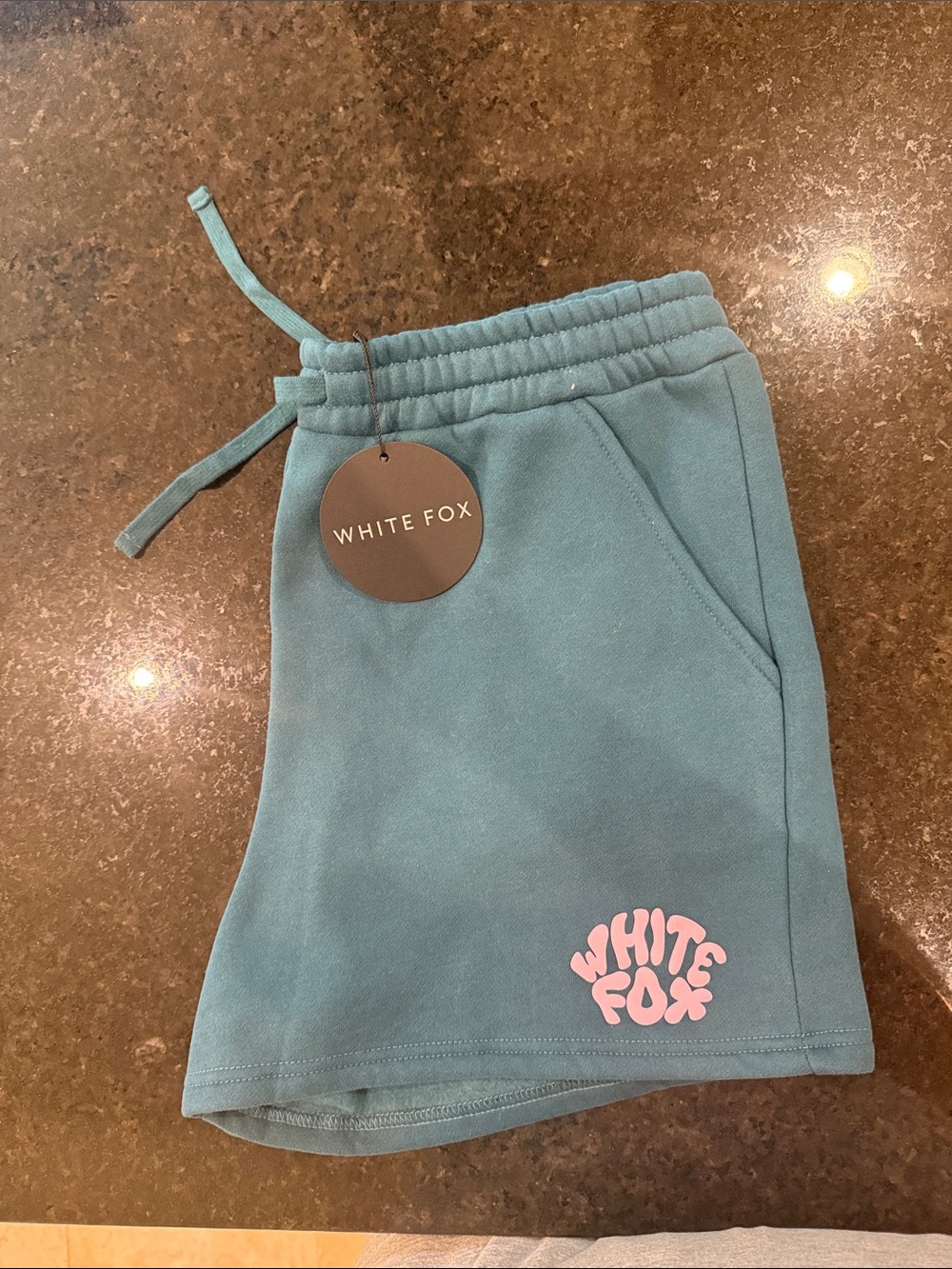 White Fox Boutique Teal Shorts with Pink Logo